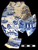 Pearlware soup plate printed underglaze in medium blue in the Blue Willow pattern.  Printed mark on reverse “Riley’s Semi China” and an impressed asterisk.  John and Richard Riley 1802-1828), Burslem.